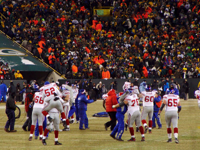 Giants players celebrate after the game winning field goal.