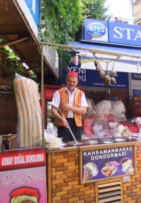 Ice cream seller calls customers by ringing his cow bells