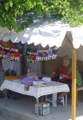 Turkish lady knitting dolls that look just like her