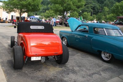 Orange Roadster and Studebacker
