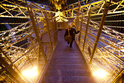Kim descending the Eiffel Tower stairs.