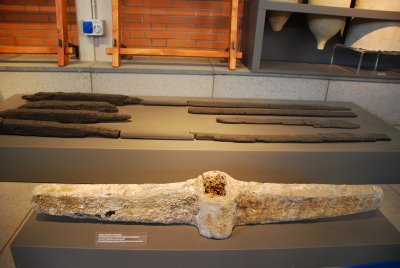 An anchor and pieces of wood preserved by the volcano