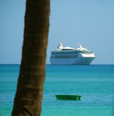 A ship, a boat and a tree