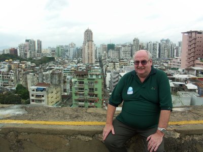 Ken sitting at the Fortaleza do Monti with Macau in the background