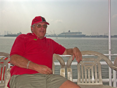 Dave on the tour boat with the QM2 in the background