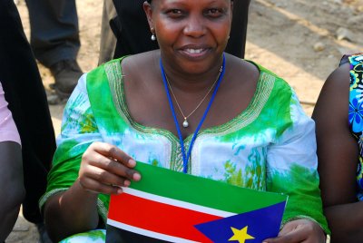 Woman holding the South Sudan flag