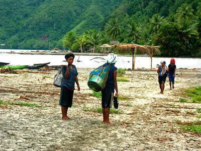 Local girls walking home after washing dishes in river