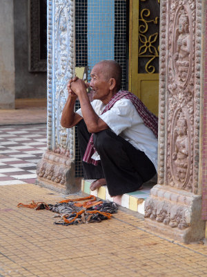 OLD MAN ON TEMPLE STEPS