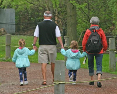 DAD, DAUGHTERS AND GRANDMA AT THE ZOO
