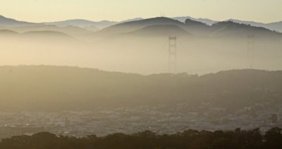 GOLDEN GATE BRIDGE IN THE EVENING FOG: FROM TWIN PEAKS