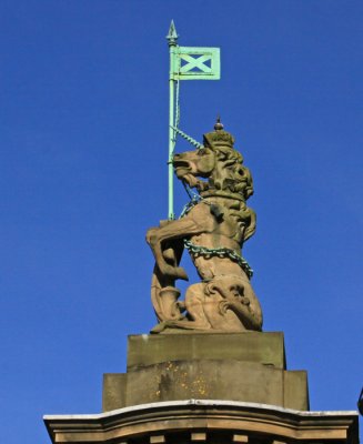 CARVED FIGURE AT ENTRANCE