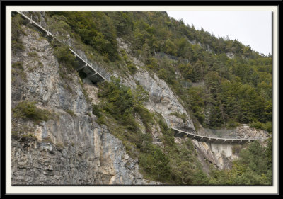 The Answer would be to build a road along the Cliff Face!!!