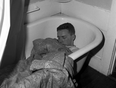 Paul Willis sleeping it off in Rose's bath tub.