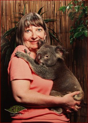 68.Koala having his picture taken with my wife.