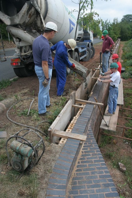 The ready mix concrete being poured ...