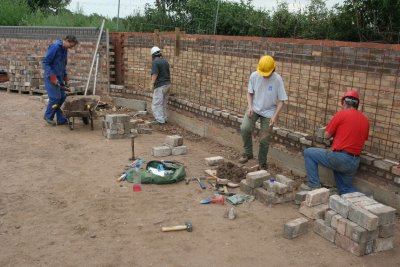 Lesley, Tracey & Bob start the bricklaying