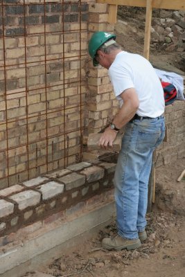 Alan tying in to the original brickwork ...