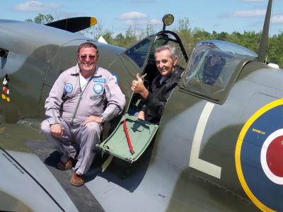 Dave VE3BBN getting his first lessonin the Spitfire from Alan Walker the pilot