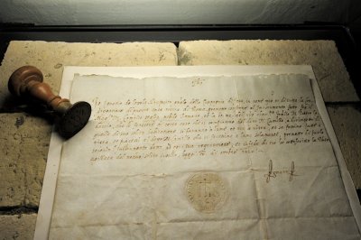 a handwritten letter of St Ignatius and his personal seal with his signature