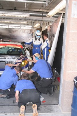 Three Butts working on a Ferrari F430 racecar.