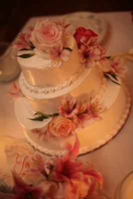 Clean elegant wedding cake with pink florals. Photo by Jessica Claire - www.jcsphoto.com