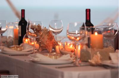 Scattered Candles with conch shell centerpiece - Photo by Kevyn Spiro