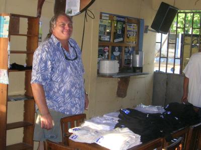 Dr Jim selling t shirts for the clinic