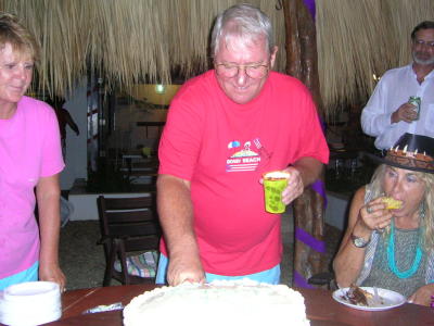 Tim cutting the cake