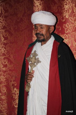 Priest with cross at Lalibela