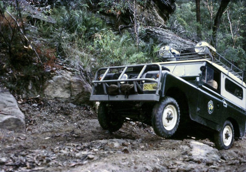 A SWB LANDROVER CLEARING AN OBSTACLE