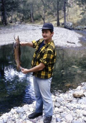 ONE OF THE BOYS WITH A NICE TROUT.