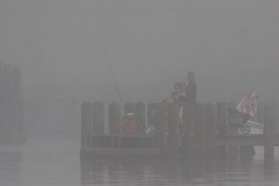 Fishing on a foggy morning.