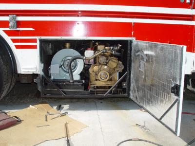 A SWING OPEN DOOR WAS ADDED FOR EASY ACCESS TO THE FLUID LEVELS AND BELT, WITHOUT HAVING TO SLIDE THE GENSET DRAWER OUT
