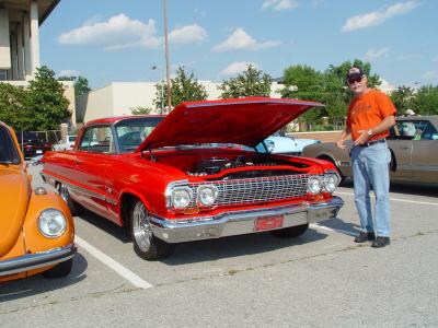 Here is John Amos next to a Chevy like the one that was his first car back in Kansas