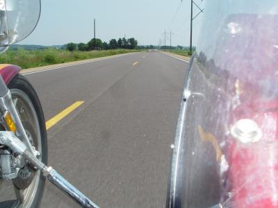 A VIEW FROM BETWEEN THE SIDECAR AND THE BIKE AT SPEED