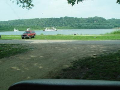 HERE'S AN EXCURSION BOAT AND SOME SMALL BOATS
