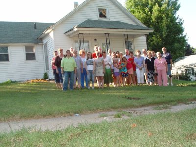SOME OF THE FAMILY MEMBERS GATHER IN FRONT OF OUR GRANDPARENTS OLD HOUSE THAT IS STILL BEING USED
