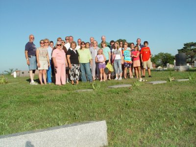 SOME OF US GATHER AT THE GRAVE SITE OF OUR GRANDPARENTS