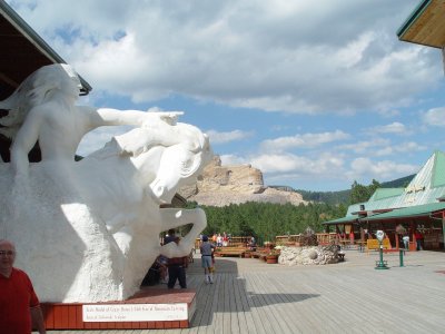 THE CRAZY HORSE SCULPTURE WITH THE UNFINISHED, WORK IN PROGRESS MONUMENT IN THE BACKGROUND