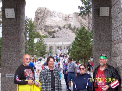 IT WAS A DAMP RIDING DAY WHEN WE WENT TO MOUNT RUSHMORE, THUS THE RAIN SUITS