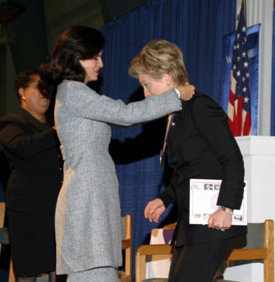 Board president placing the medalion...