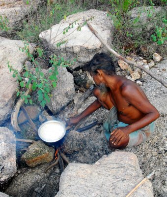 Vedda Man Cooking Rice