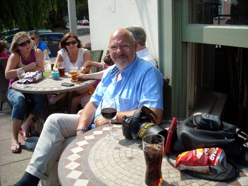 Me on a terrace with a good glass of wine