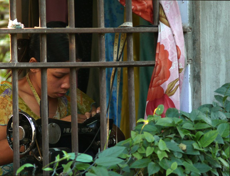 Tied to her job, Hoi An, Vietnam, 2007