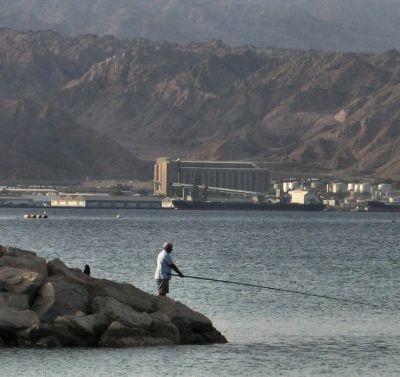 Fishing In Eilat With Akaba Harbour At Background .JPG