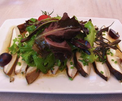 Salad of raw cep mushrooms with grapes and nutmeg oil