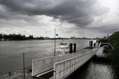 The sky is so heavy and low that is falling into the Scheldt