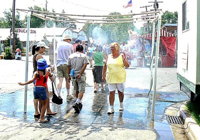 Fairgoers Cool Off in the Shower