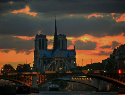 notre dame from seine river cruise, paris france