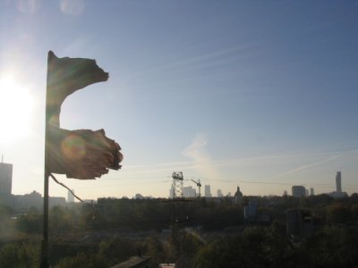 Anarchist flag blowing in the wind (Squat Fabryka)